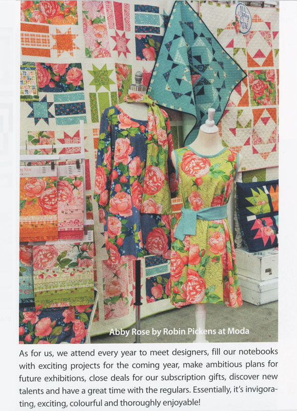 Robin Pickens booth at Quilt Market showing Abby Rose fabric with Moda Fabrics