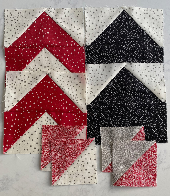 https://rafflecreator.com/pages/16679/cotton-cuts-spring-puzzle-mystery-quilt-raffle pieces black and white