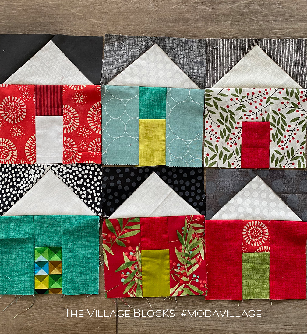 The Village quilt in Christmas fabrics
